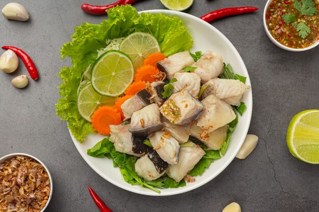 Boiled fish with spicy dipping sauce and vegetable