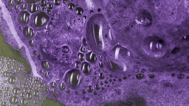 Free photo boiling lilac liquid with foam and blobs