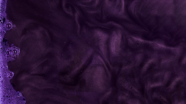 Free photo boiling purple stiff paint with foam