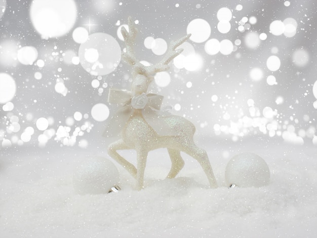 Bokeh background of christmas reindeer nestled in snow