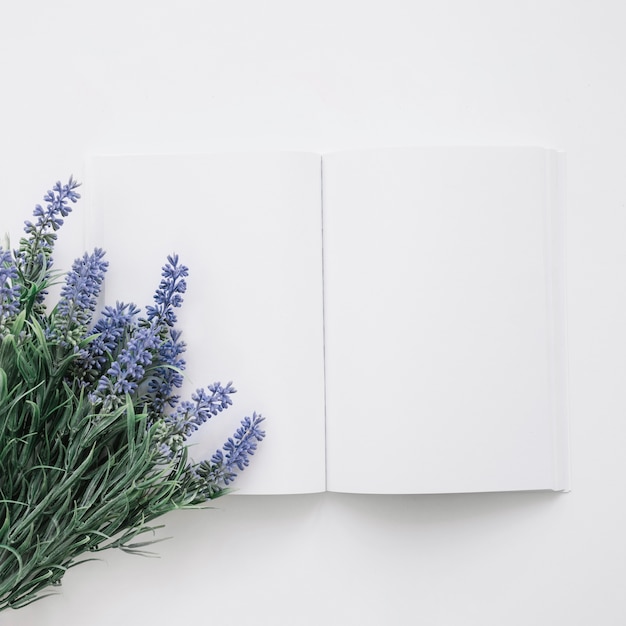 Book cover mockup with natural flowers