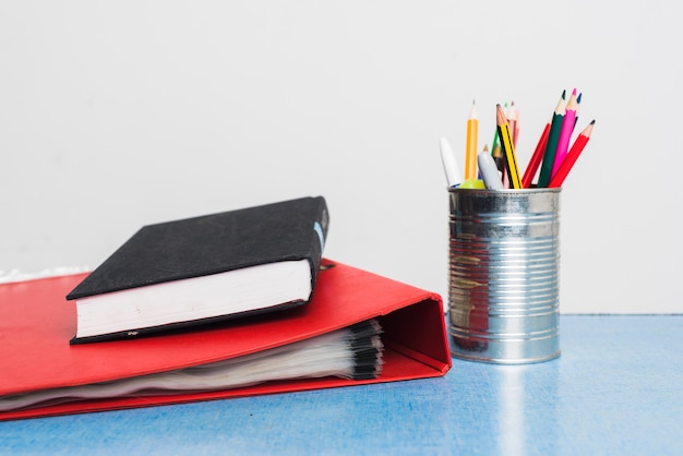 Book and folder near stationery