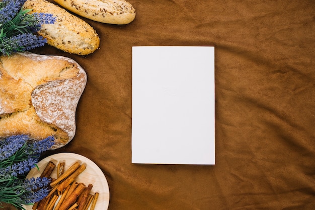 Book mockup with bread and cinnamon