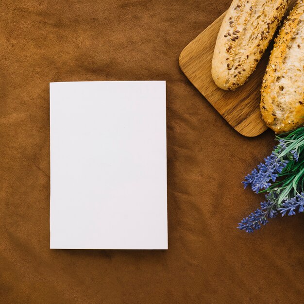 Book mockup with bread and flower