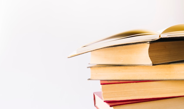 Book pile with open book at the top