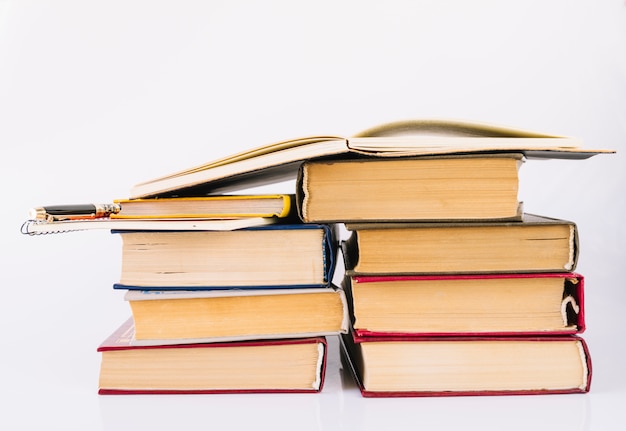 Book pile with open book at the top