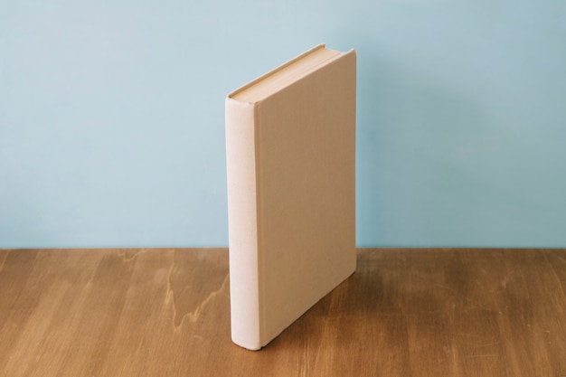 Book standing on wooden surface
