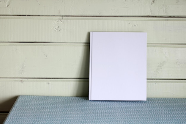 Free photo a book with an empty cover mockup space for mounting your object