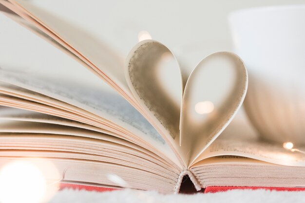 Book with its pages shaping as a heart