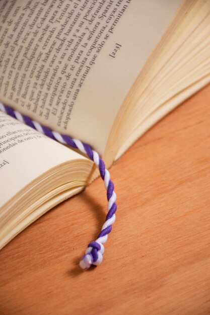 Book with textile bookmark high angle