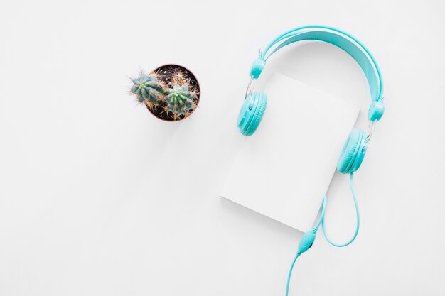 Booklet mockup with cactus and headphones