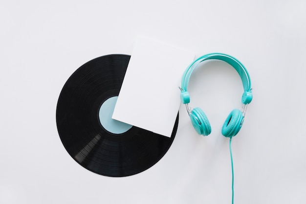 Free photo booklet mockup with vinyl and turquoise headphones