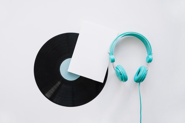 Booklet mockup with vinyl and turquoise headphones