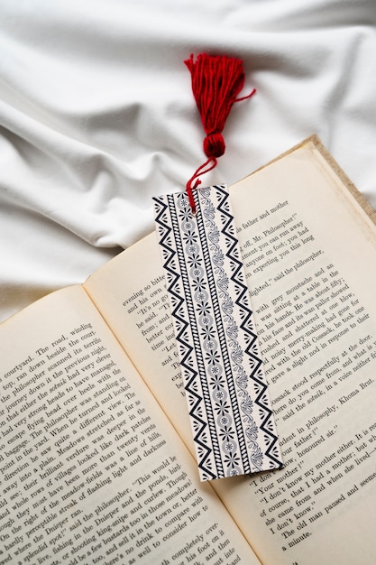 Bookmark on book arrangement flat lay