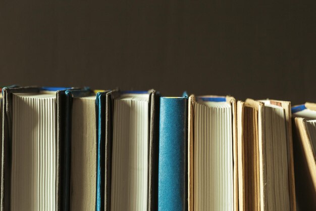 Books close up on old wooden table