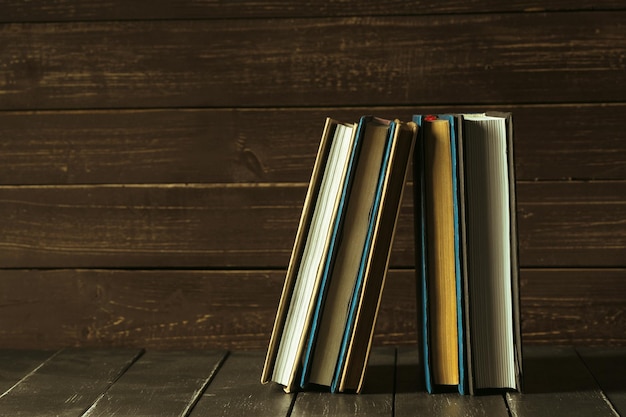 Books close up on old wooden table