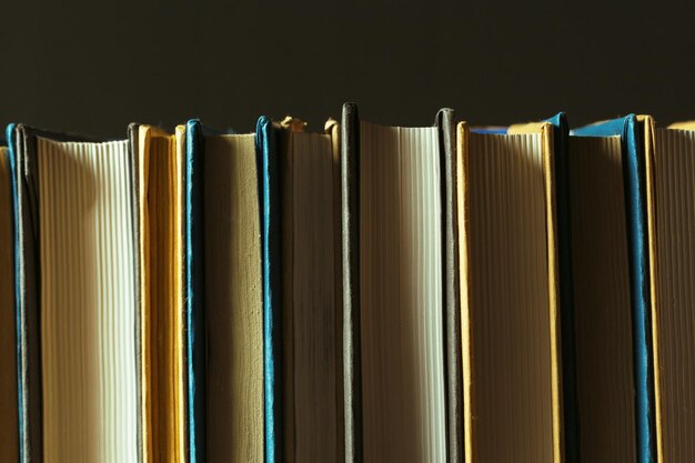 Books close up on old wooden table