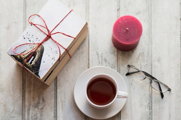 Books, coffee, candle and glasses