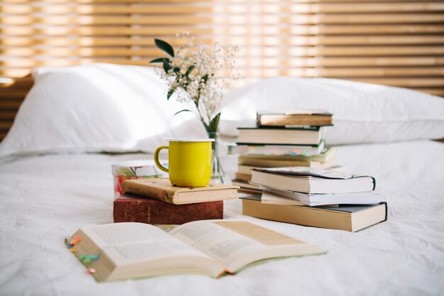 Books composition on bed