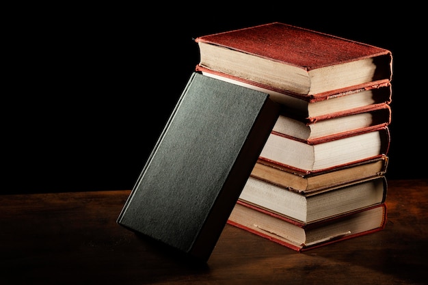 Books stack on wooden table