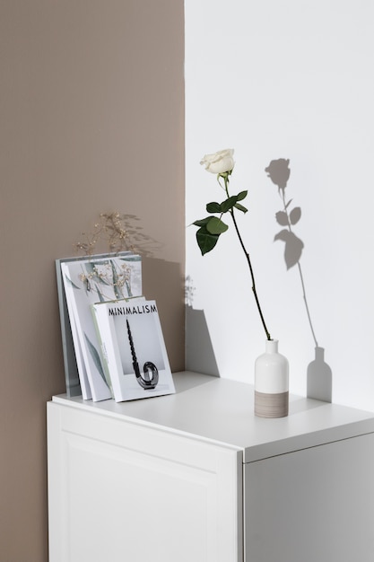Books and white rose arrangement