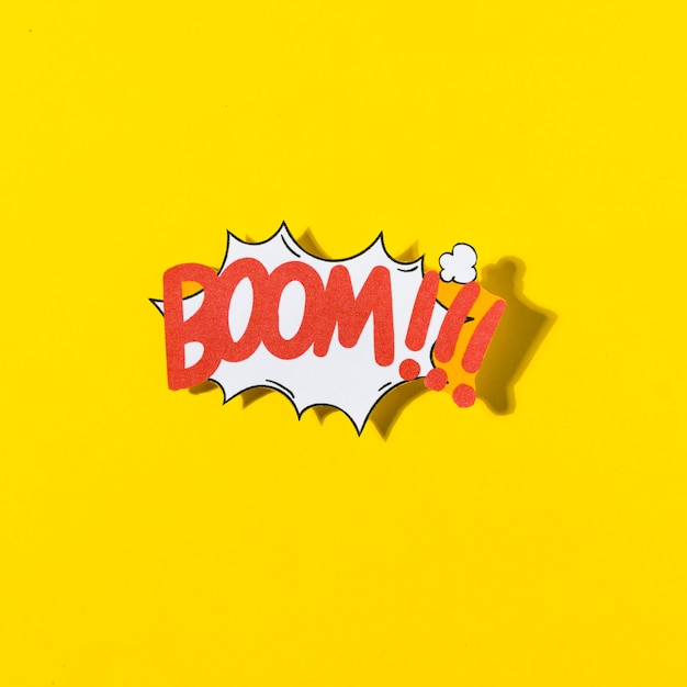 Boom cartoon illustration text in retro pop art style on yellow background