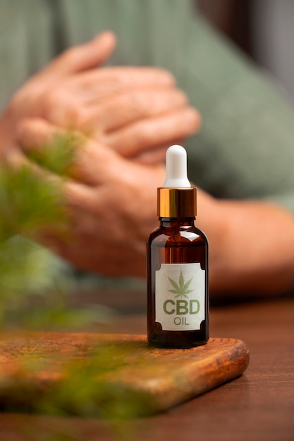 Free photo boomers using cbd oil and cream for treating body pain