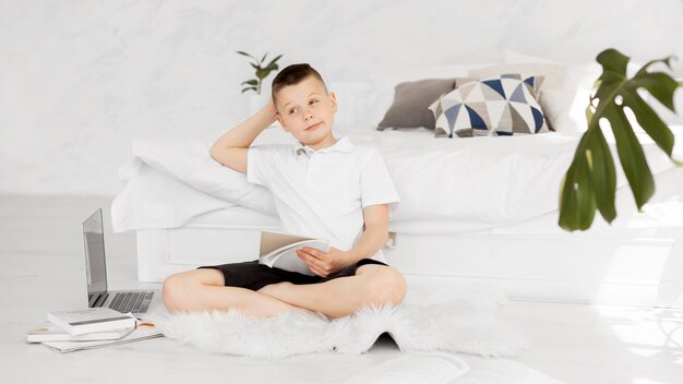 Bored pupil holding his notebook