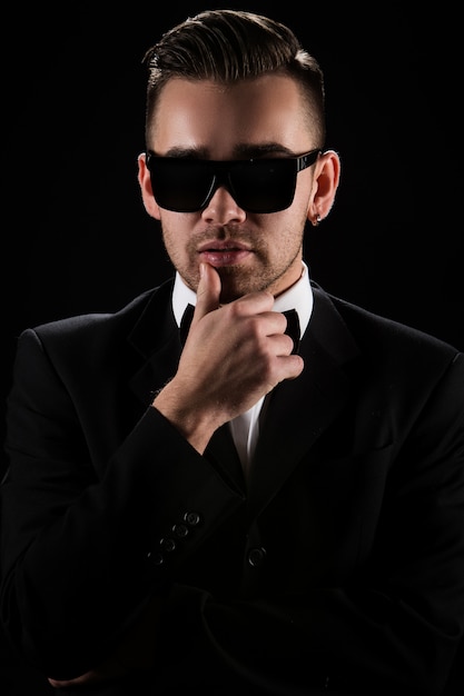 Free photo boss, gentleman. attractive businessman in black suit