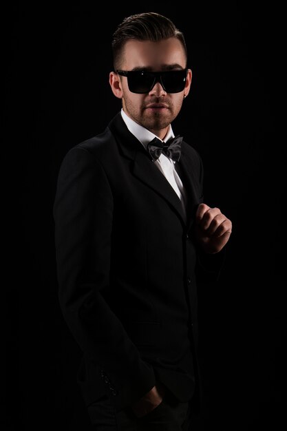 Boss, gentleman. Attractive businessman in black suit