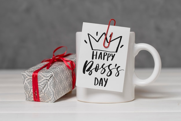 Boss's day arrangement with present and cup