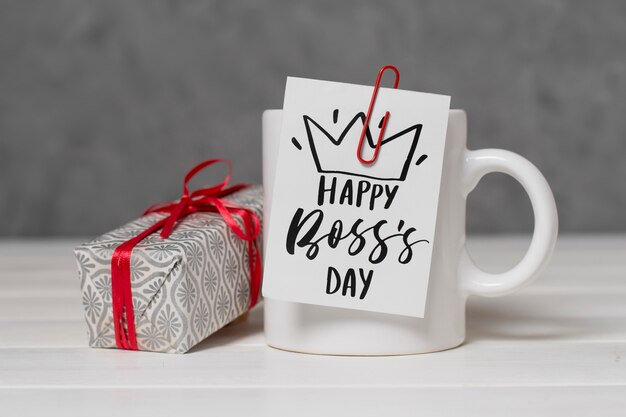 Boss's day arrangement with present and cup