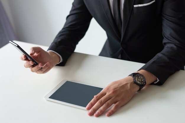 Boss studying reports on gadgets screen