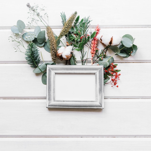 Free photo botanical composition with frame and leaves