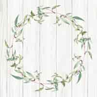 Free photo botanical green wreath on a wooden background