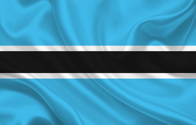 Botswana country flag on wavy silk fabric background panorama - illustration