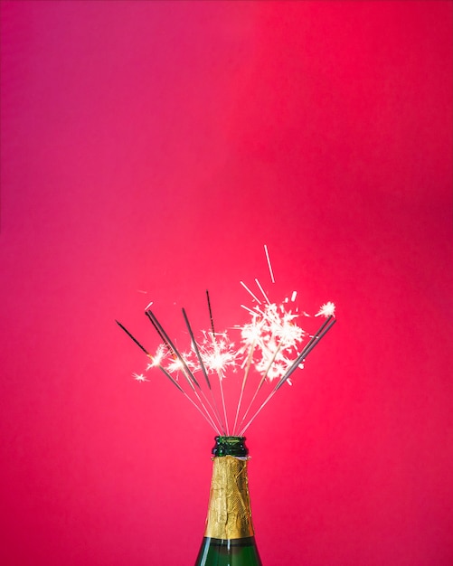 Bottle of champagne with sparklers