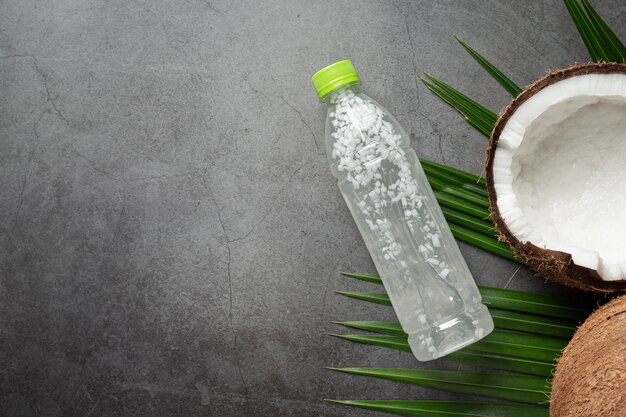 bottle of coconut water put on dark background