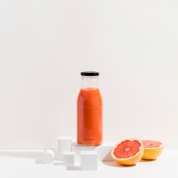A bottle of fresh red orange juice