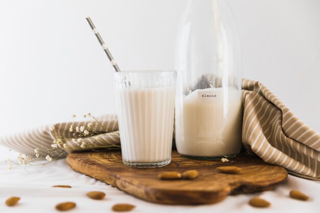 Bottle and glass of milk with nuts