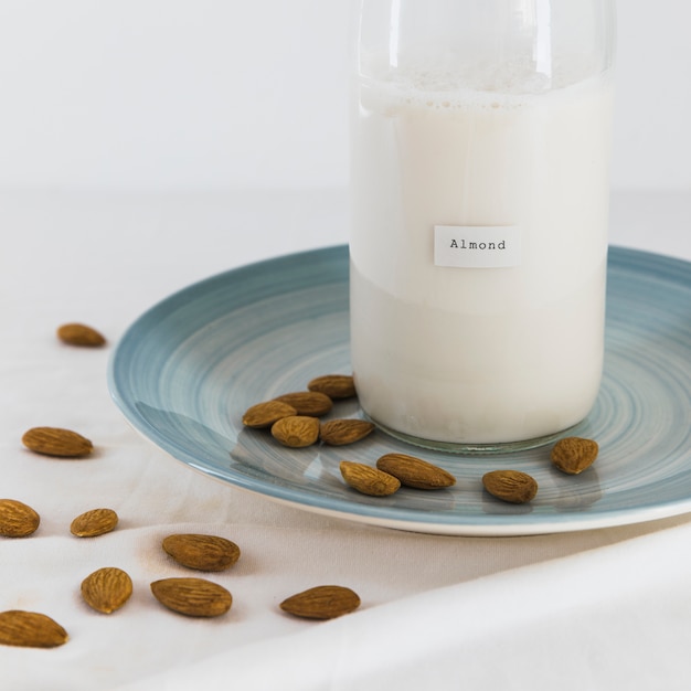 Free photo bottle of milk and nuts