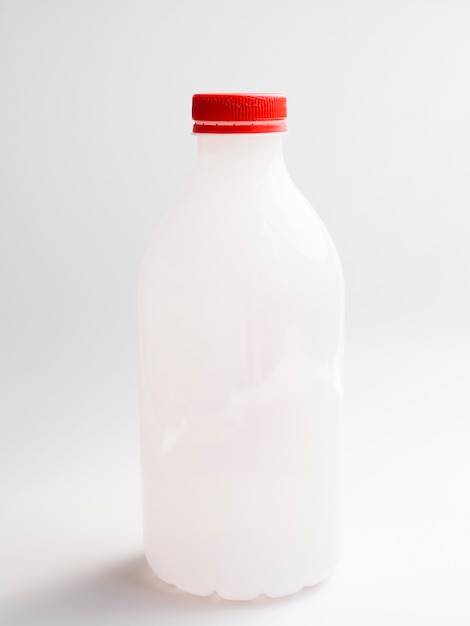 Bottle of milk with red lid