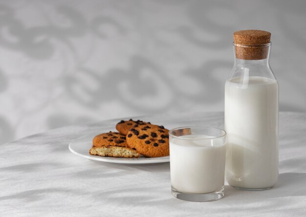 Bottle of milk with sweet cookies