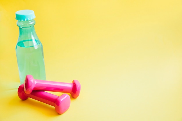 Bottle of water and dumbbells