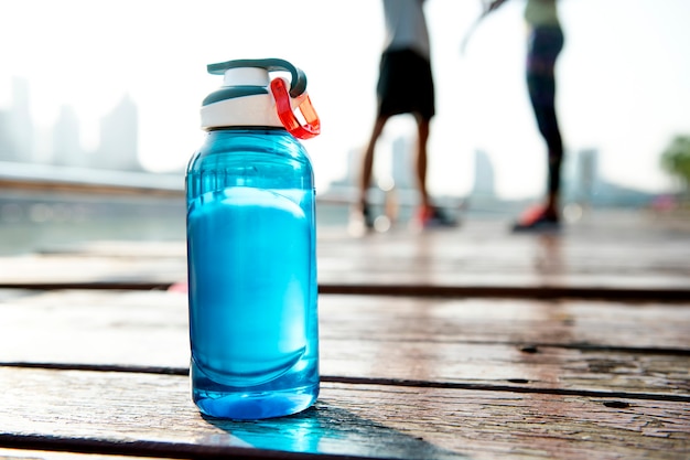 Bottle of water on plank in a park