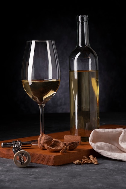 Bottle of wine and glass with opener