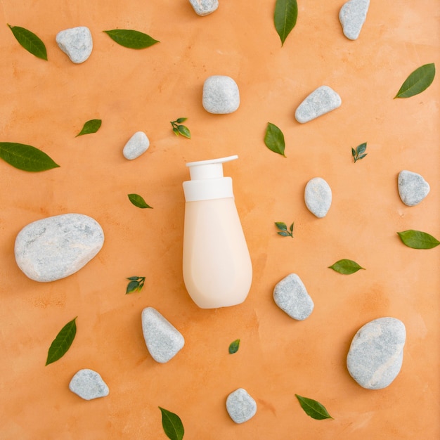 Free photo bottle with lotion on table