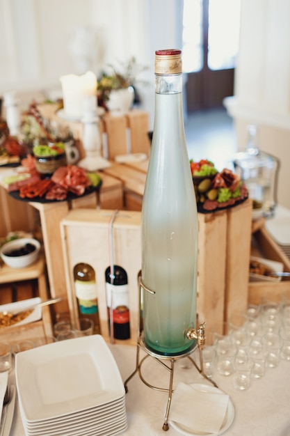 Bottle with vodka stands on the table