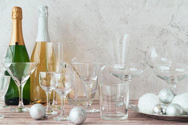 Bottles of champagne with glasses on the table