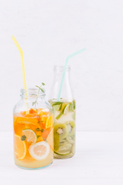 Bottles of fruit drink on table